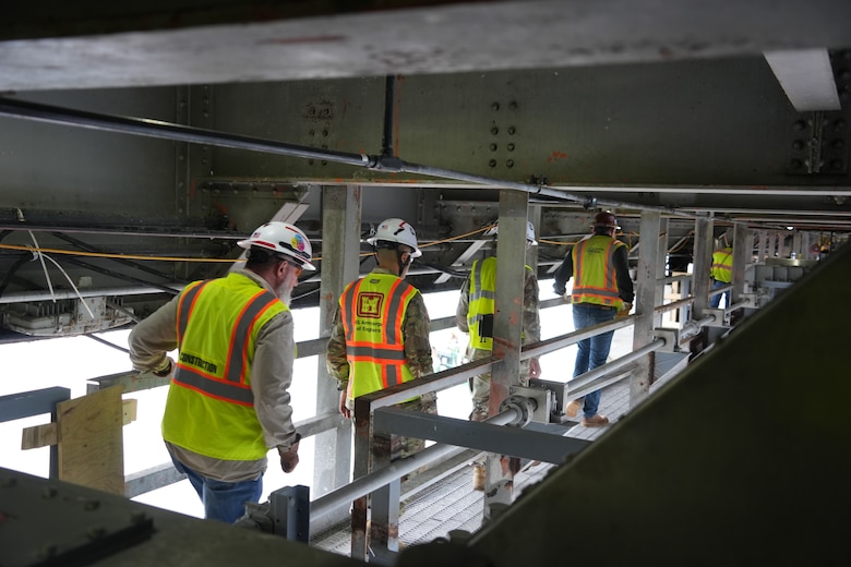 LANCASTER, Tenn. (Feb. 19, 2026) – U.S. Army Corps of Engineers subject matter experts and leaders, along with a contractor from American Bridge Company, show Col. Herlihy, commander of the Great Lakes and Ohio River Division, a close-up view of the spillway gates from inside the Pier 1 access hatch at Center Hill Dam in Lancaster, Tennessee, Feb. 19, 2026. The tour provided Herlihy with a detailed, firsthand perspective on the ongoing spillway gate replacement project. The U.S. Army Corps of Engineers Nashville District is replacing spillway gates at Wolf Creek Dam in Jamestown, Kentucky, and Center Hill Dam in Lancaster, Tennessee, to upgrade its flood risk and water management infrastructure in the Cumberland River Basin. In this photo, spillway gates are assembled on a barge at Center Hill Dam Feb. 19, 2026. (USACE Photo by Noe Gonzalez)