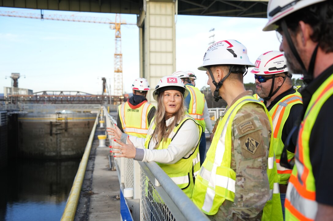 CHATTANOOGA, Tenn. (Feb. 20, 2026) – Cayce Grall, project manager for the U.S. Army Corps of Engineers Nashville District, briefs Col. Herlihy, commander of the Great Lakes and Ohio River Division, during a tour of the Chickamauga Lock Replacement Project in Chattanooga, Tennessee, Feb. 20, 2026. Progress on the multi-contract project includes the new lock chamber at 76 percent completion and the upstream approach wall at 70 percent, with the final contract awarded in February. The new 110-by-600-foot lock will process nine jumbo barges in one lockage, compared to one in the existing lock, an 80% increase in efficiency for the navigation industry.