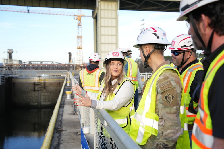 CHATTANOOGA, Tenn. (Feb. 20, 2026) – Cayce Grall, project manager for the U.S. Army Corps of Engineers Nashville District, briefs Col. Herlihy, commander of the Great Lakes and Ohio River Division, during a tour of the Chickamauga Lock Replacement Project in Chattanooga, Tennessee, Feb. 20, 2026. Progress on the multi-contract project includes the new lock chamber at 76 percent completion and the upstream approach wall at 70 percent, with the final contract awarded in February. The new 110-by-600-foot lock will process nine jumbo barges in one lockage, compared to one in the existing lock, an 80% increase in efficiency for the navigation industry.