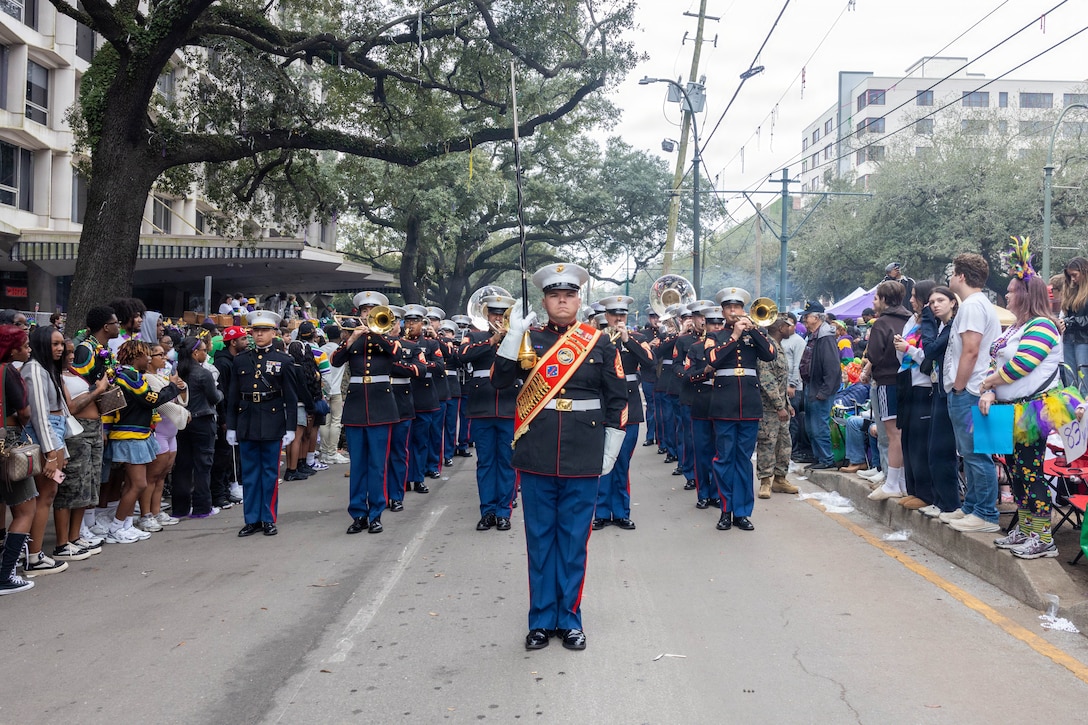 U.S. Marine Corps Gunnery Sgt. Craig Palmer, the drum major of the 1st Marine Division Band, leads the band during the Zulu Mardi Gras Parade as part of the Mardi Gras celebration in New Orleans, Feb. 17, 2026.