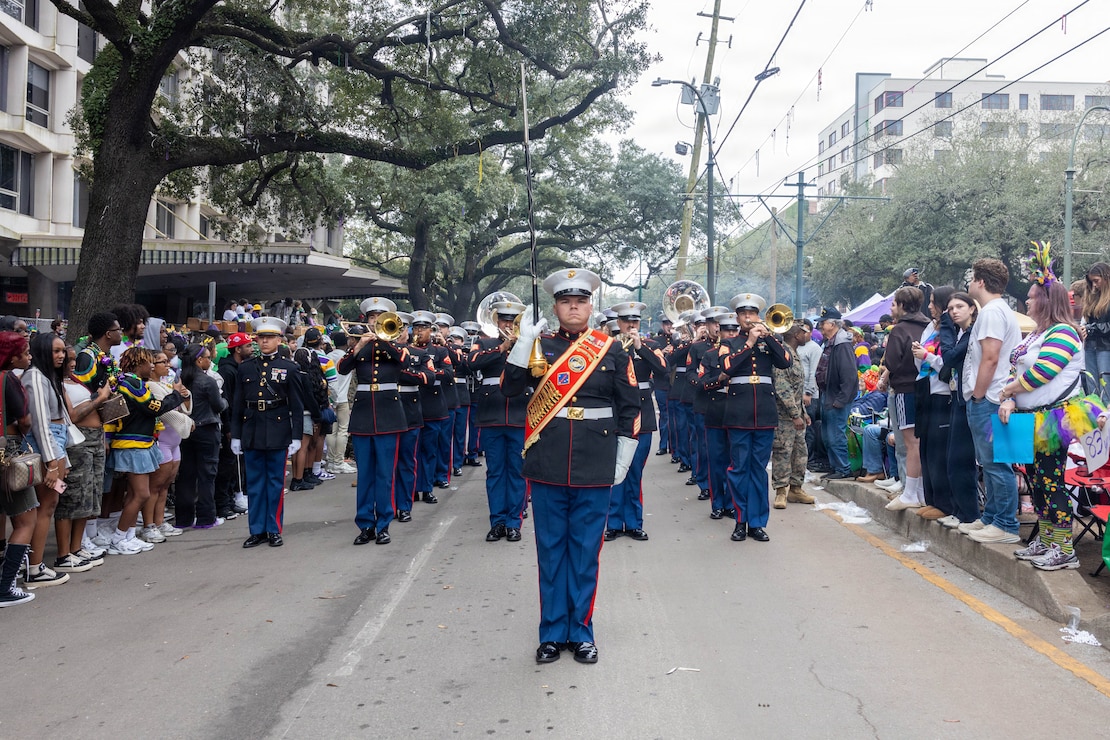 U.S. Marine Corps Gunnery Sgt. Craig Palmer, the drum major of the 1st Marine Division Band, leads the band during the Zulu Mardi Gras Parade as part of the Mardi Gras celebration in New Orleans, Feb. 17, 2026.