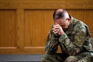U.S. Army Lt. Col. Kevin Daul, 673d Air Base Wing deputy installation chaplain, prays during a service honoring the Four Chaplains at the Arctic Warrior Chapel on Joint Base Elmendorf-Richardson, Alaska, Feb. 3, 2026. The legacy of the Four Chaplains remains a powerful source of inspiration for the religious support teams that help promote spiritual fitness throughout the service. (U.S. Air Force photo by Airman 1st Class Theodore Gowdy)