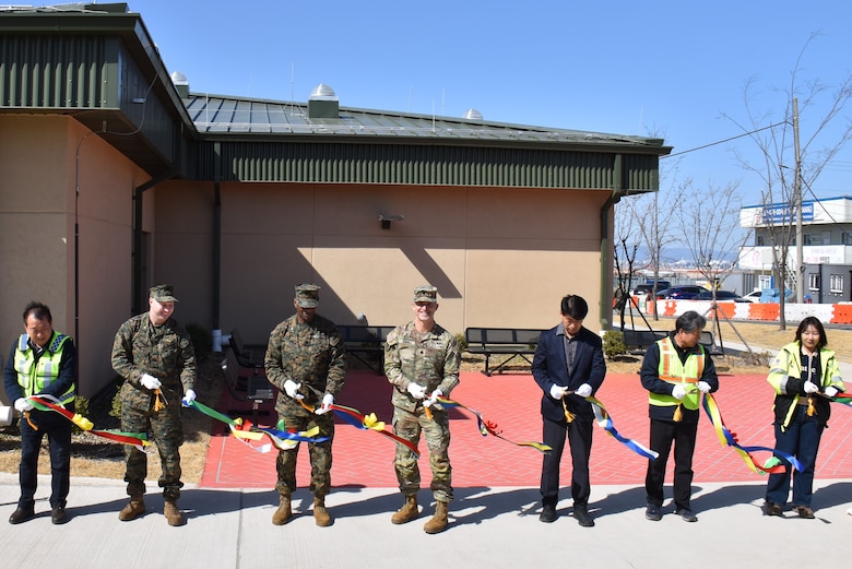 Col. William Doctor, Camp Mujuk commander; Lt. Col. Robert Howell, U.S. Army Corps of Engineers – Far East District deputy commander; the Republic of Korea Ministry of National Defense – Defense Installations Agency (MND-DIA), and members of the project team gathered to cut the ribbon on an Expeditionary Dining Facility, Camp Mujuk, South Korea, on Feb. 23, 2026.