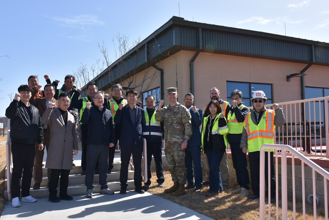 Members of the project delivery team from the U.S. Army Corps of Engineers – Far East District gather at a ribbon cutting that marks the opening of the Expeditionary Dining Facility at Camp Mujuk, South Korea, on Feb. 23, 2026.