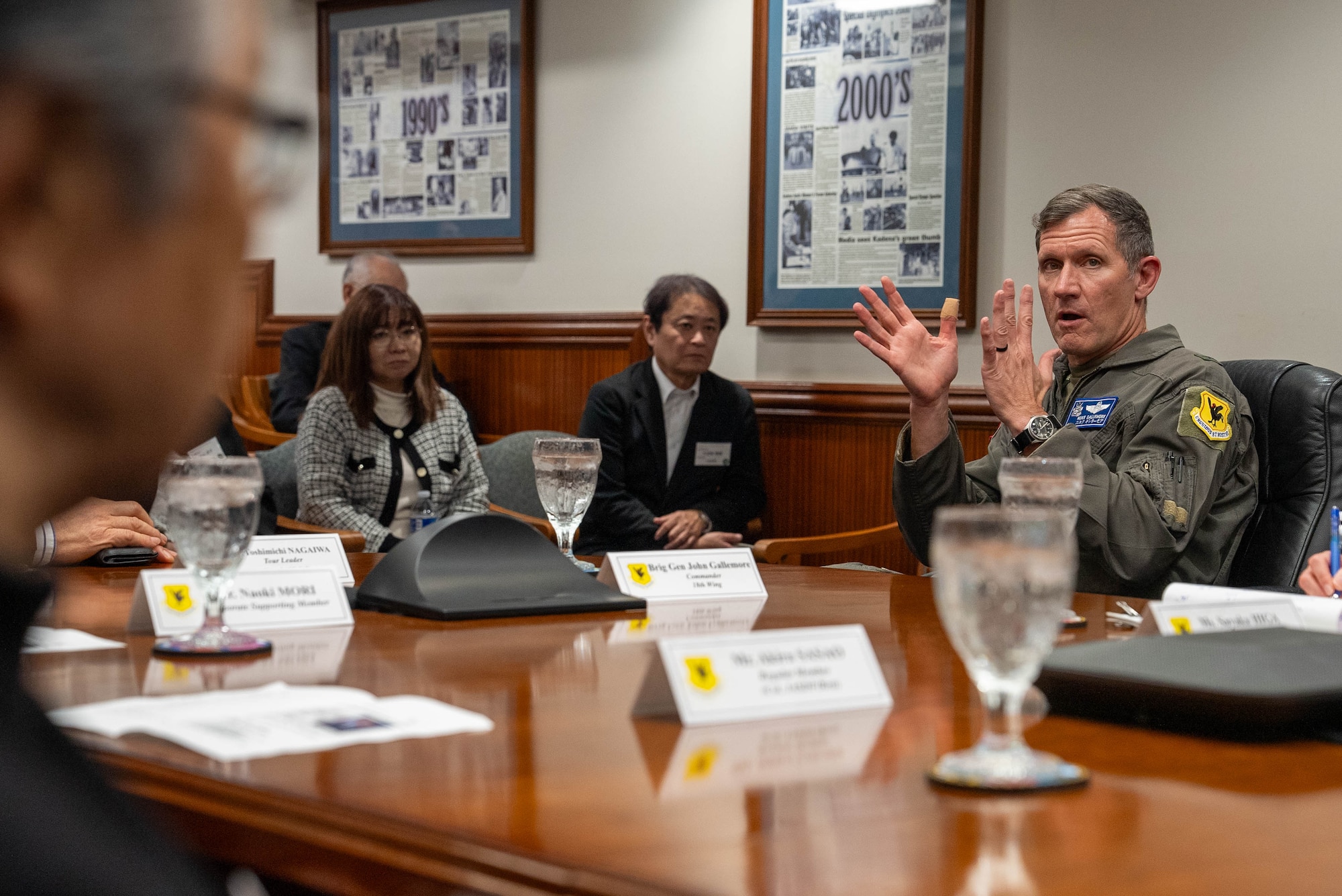 U.S. Air Force Brig. Gen. John Gallemore, 18th Wing commander, briefs visiting members of the Japan-America Air Force Goodwill Association during their visit to Kadena Air Base, Japan, Feb. 18, 2026.
