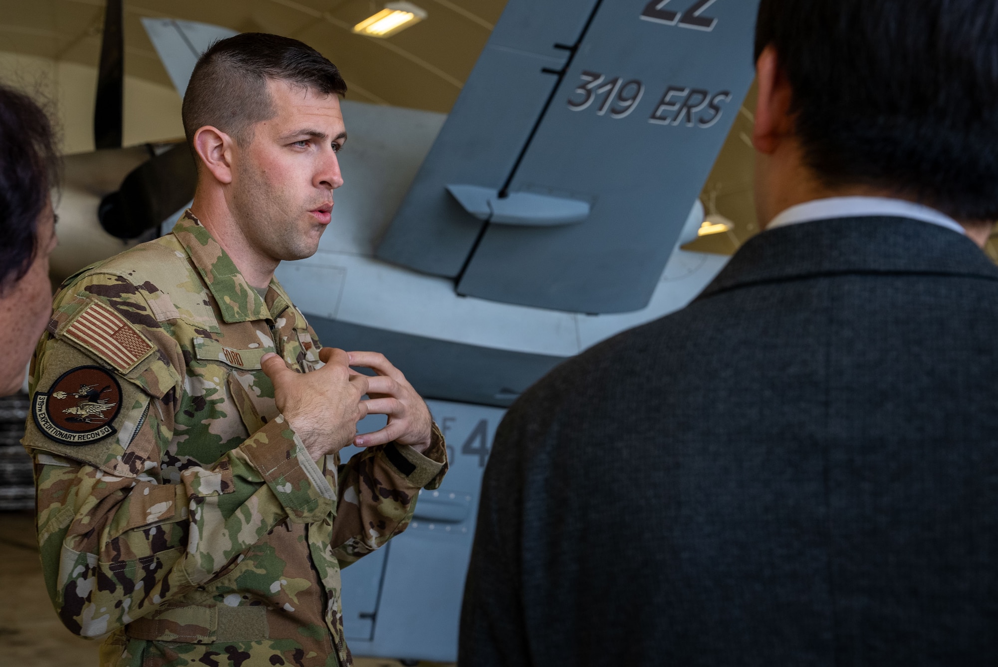 U.S. Air Force Capt. Nathan Ford, 319th Expeditionary Reconnaissance Squadron director of operations, briefs members of the Japan-America Air Force Goodwill Association, on MQ-9 Reaper capabilities during a flightline tour at Kadena Air Base, Feb. 18, 2026.