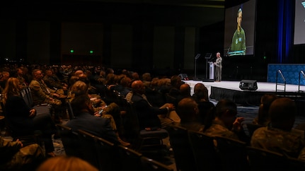Gen. Wilsbach speaks to an audience on a stage