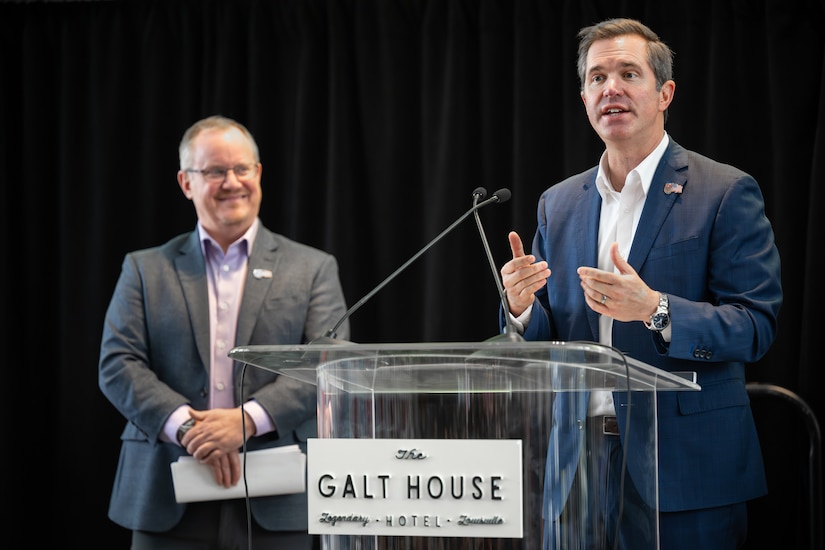 Kentucky Gov. Andy Beshear, right, speaks at a press conference in Louisville, Ky., Feb. 23, 2025, announcing the return of the Thunder Over Louisville air show and fireworks display to the banks of the Ohio River April 18, as Matt Gibson, president and CEO of show organizer Kentucky Derby Festival, looks on. Historic flooding caused the cancelation of last year’s event, which typically draws more than 100,000 spectators. (U.S. Air National Guard photo by Dale Greer)
