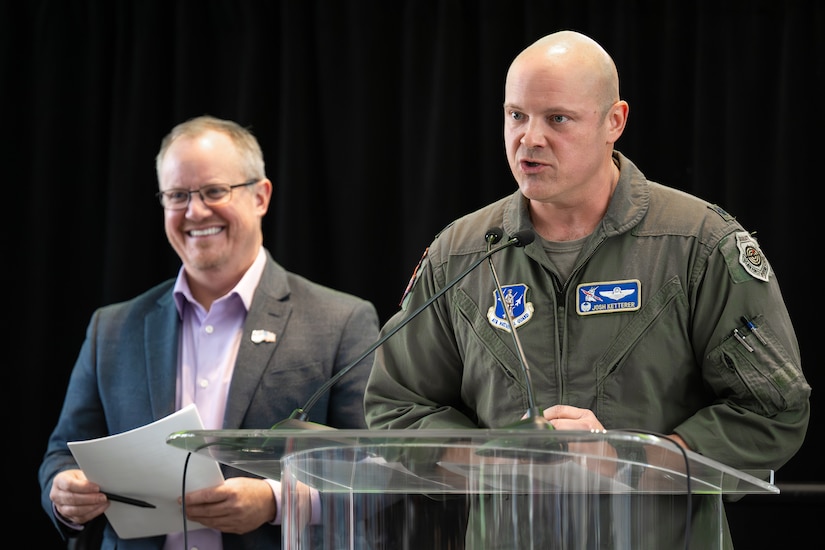 Lt. Col. Josh Ketterer, right, commander of the Kentucky Air National Guard’s 123rd Operations Group, speaks at a press conference in Louisville, Ky., Feb. 23, 2025, announcing the return of the Thunder Over Louisville air show and fireworks display to the banks of the Ohio River April 18, as Matt Gibson, president and CEO of show organizer Kentucky Derby Festival, looks on. The Kentucky Air National Guard Base in Louisville will once again serve as the center of operations for military aircraft participating in the show. (U.S. Air National Guard photo by Dale Greer)