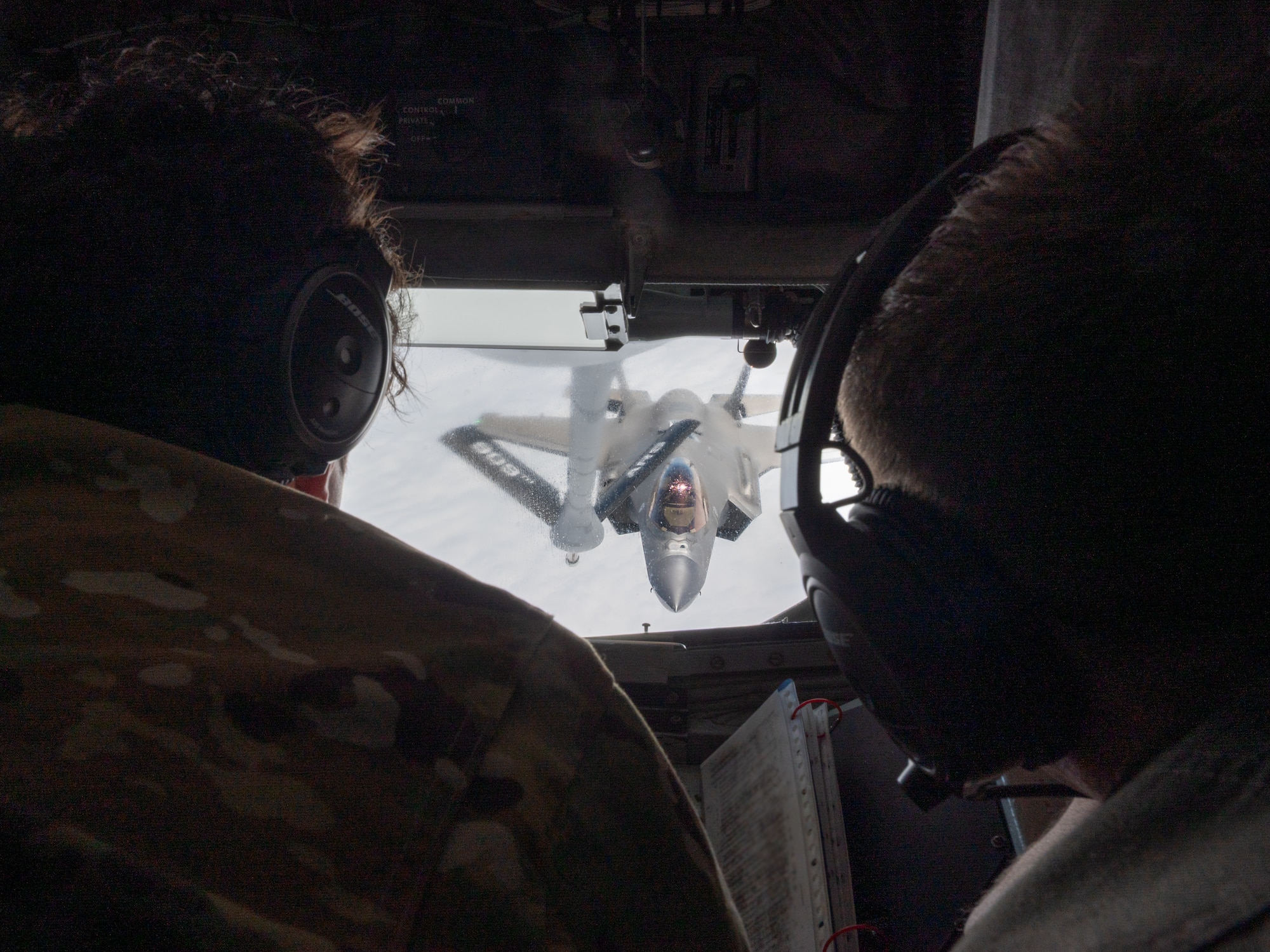 A U.S. Air Force F-35A Lightning II, assigned to the 4th Expeditionary Fighter Squadron, deployed to Kadena Air Base, conducts aerial refueling operations with a KC-135 Stratotanker assigned to the 909th Air Refueling Squadron, over the Pacific Ocean, Feb. 17, 2026.