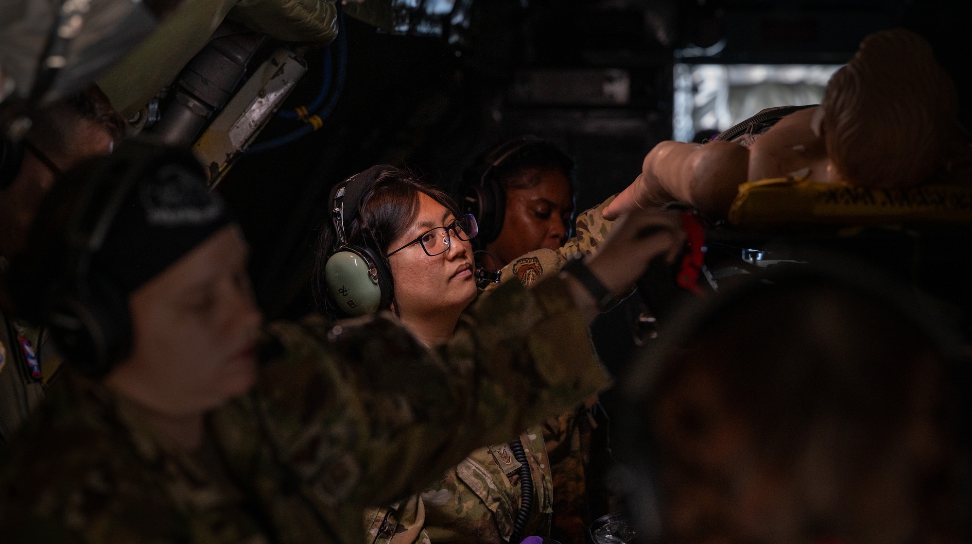 U.S. Air Force Airmen assigned to the 18th Aeromedical Evacuation Squadron evaluate simulated patients aboard a KC-135 Stratotanker assigned to the 909th Air Refueling Squadron, over the Pacific Ocean, Feb. 17, 2026.