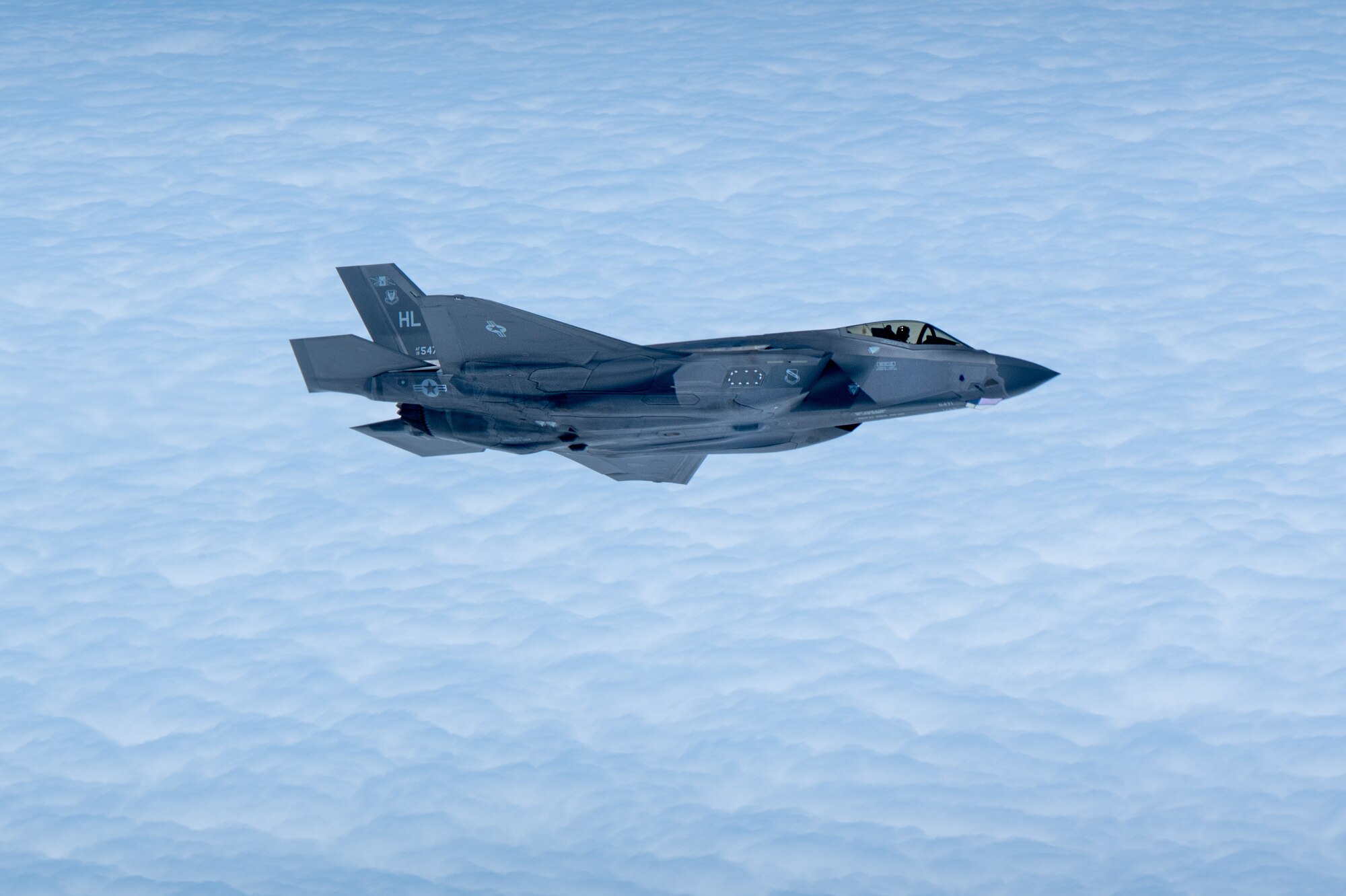 A U.S. Air Force F-35A Lightning II assigned to the 4th Expeditionary Fighter Squadron, deployed to Kadena Air Base, flies over the Pacific Ocean, Feb. 17, 2026.