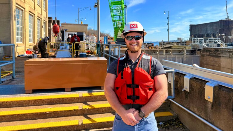 Mechanical Engineer Paul McDonald poses Feb. 24, 2026, at the Wilson Auxiliary Lock on the Tennessee River in Florence, Alabama, where he is working with a team to replace the critical hydraulic cylinders and the complex web of piping, pins, and A-frame assemblies that power the lock's massive filling and emptying valves to keep the navigation lock ship shape. (USACE Photo by Cayce Grall)