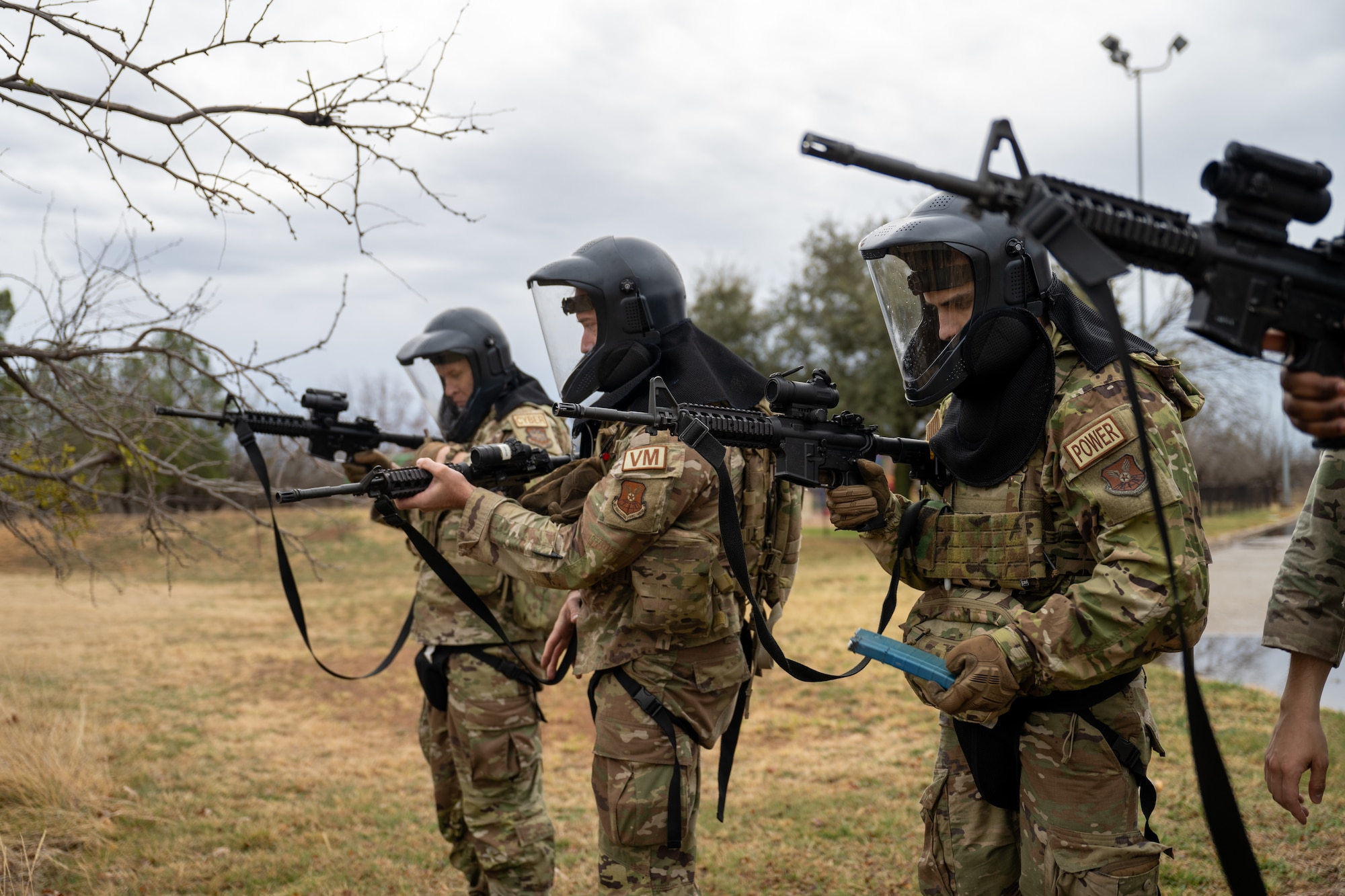U.S. Airmen assigned to the 21st Combat Air Base Squadron prepare for Close Quarters Battle training during exercise Bamboo Eagle 26-1 at Dyess Air Force Base, Texas, Feb. 14, 2026. The training enhanced survivability by developing disciplined movement, positive identification of targets and coordinated action in close-proximity engagements. (U.S. Air Force photo by Airman 1st Class Adrien Tran)