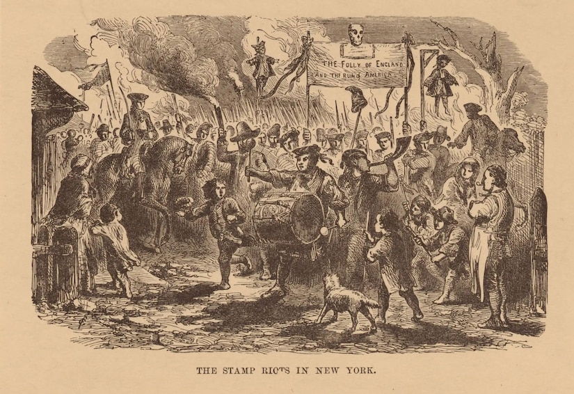 A wood engraving of a group of people in colonial attire engaging in a chaotic scene holding torches as a man beats a drum and another man in a military uniform on a horse wields a sword.