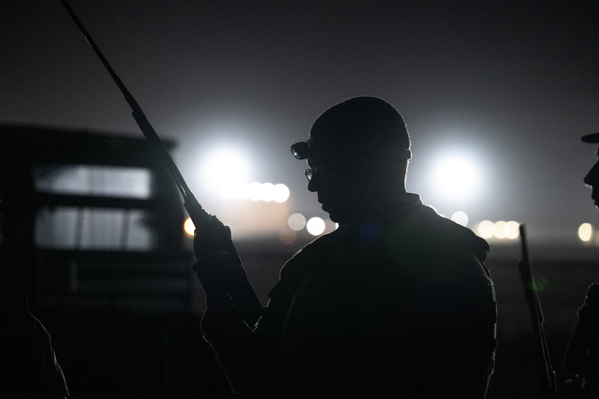 U.S. Air Force Tech. Sgt. Darrin Brewer, 21st Combat Air Base Squadron noncommissioned officer in charge of production control, directs communications with a C-130J Super Hercules, assigned to the 317th Airlift Wing, during exercise Bamboo Eagle 26-1 at Dyess Air Force Base, Texas, Feb. 18, 2026. The 21st Air Task Force tests and employs new, innovative concepts including distributed command and control, dynamic base operations and support, and adaptive logistics. (U.S. Air Force photo by Airman 1st Class Adrien Tran)