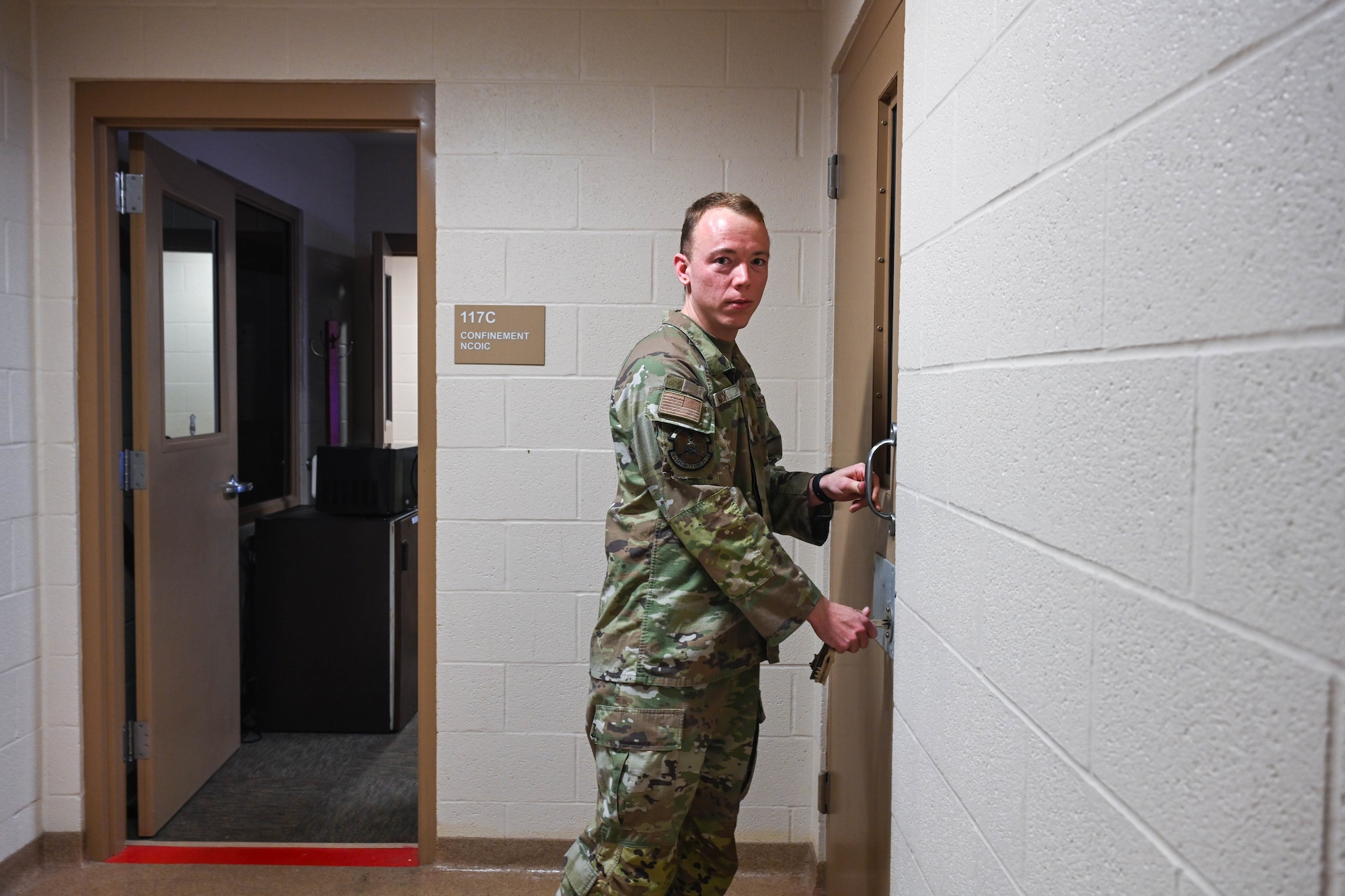 Man opens door.