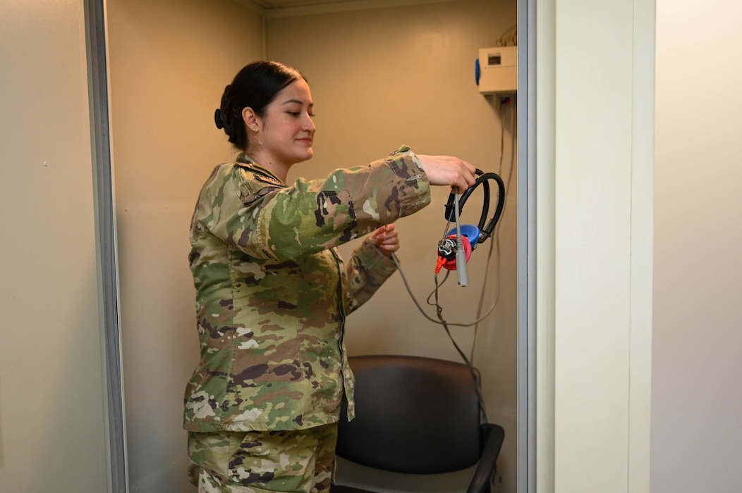 Woman hangs medical gear.