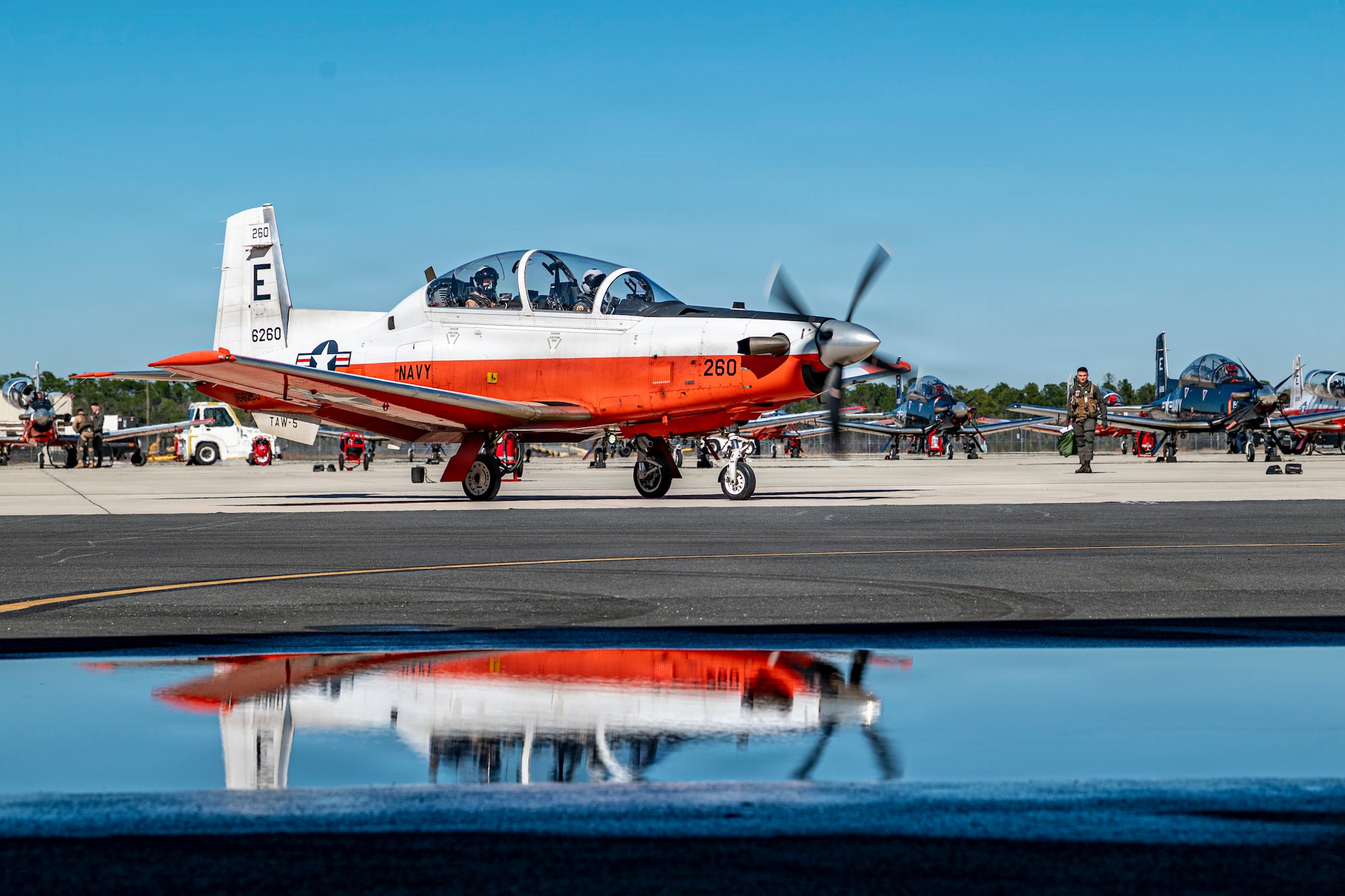 A U.S. Navy T-6 Texan II taxies down a runway at Avon Park Air Force Range, Florida, Jan. 27, 2026. The training marked the first time primary naval aviation training was conducted at the Air Force range. (U.S. Air Force photo by Senior Airman Leonid Soubbotine)