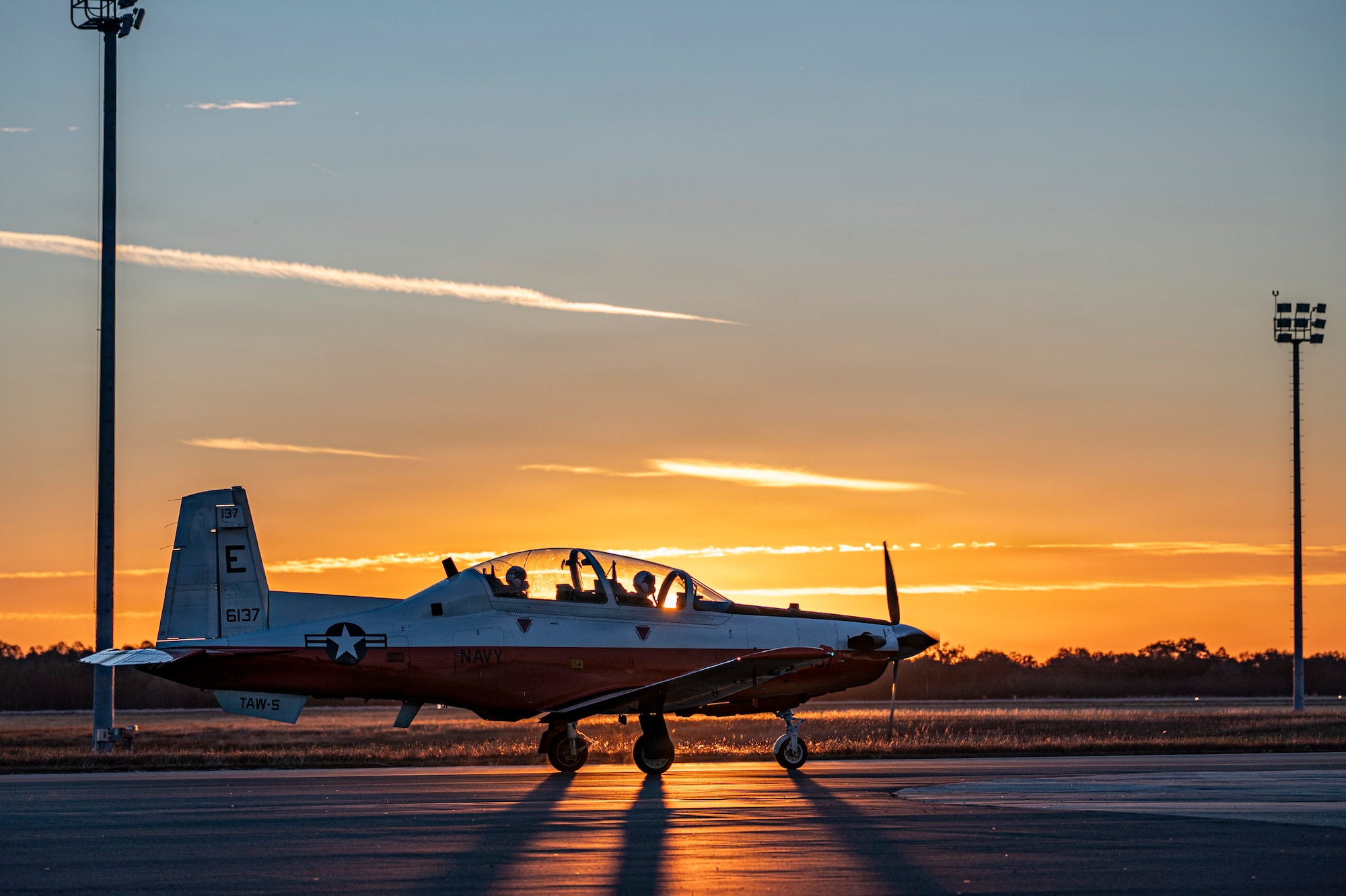 A U.S. Navy T-6B Texan II taxies down a runway at Avon Park Air Force Range, Florida, Jan. 28, 2026. The T-6B Texan II is used to train student naval aviators in the primary stages of flight training. (U.S. Air Force photo by Senior Airman Leonid Soubbotine)