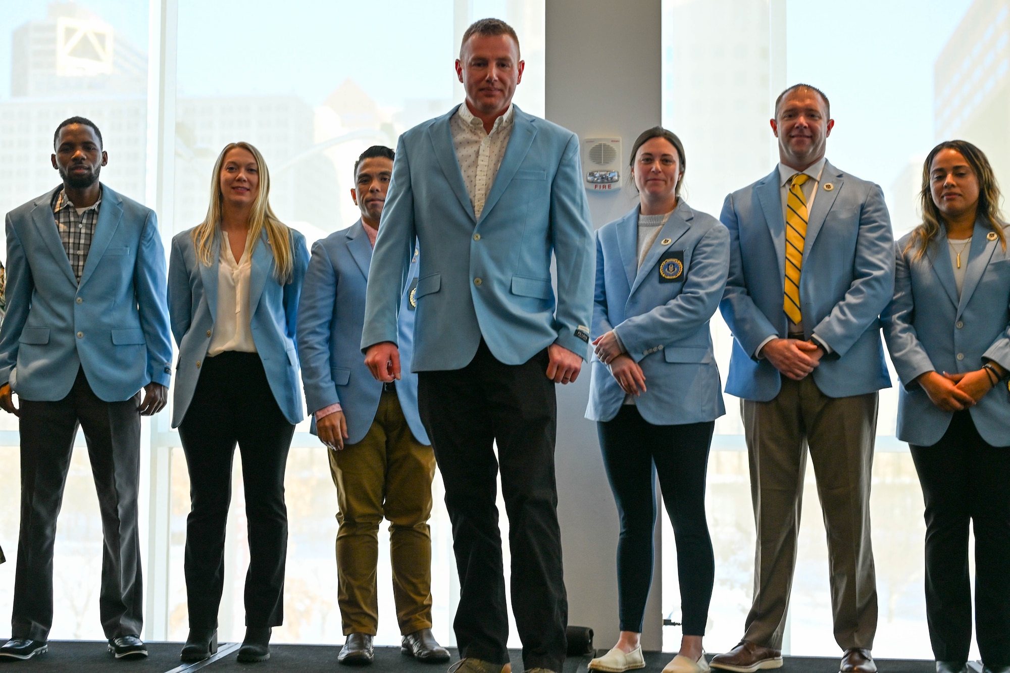 Master Sgt. Justin Schutz, Air Force Reserve recruiter, 350th Recruiting Squadron, stands center while fellow AFR recruiters from the 367th Recruiting Group, Robins Air Force Base, Georgia, celebrated new Operation Blue Suit members during the Recruiting Training Event Jan 26, 2026, in St. Louis, Missouri. The RTE held Jan 25-30, 2026, trains Air Force Reserve recruiters and celebrates recruiting accomplishments over FY25 after exceeding the AFR recruiting goal of 7,600 for a second consecutive year. (U.S. Air Force photo by Tech. Sgt. Della Creech)