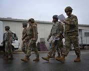 photo of Airmen navigating through checkpoints during Prime Base Engineer Emergency Force (Prime BEEF) training