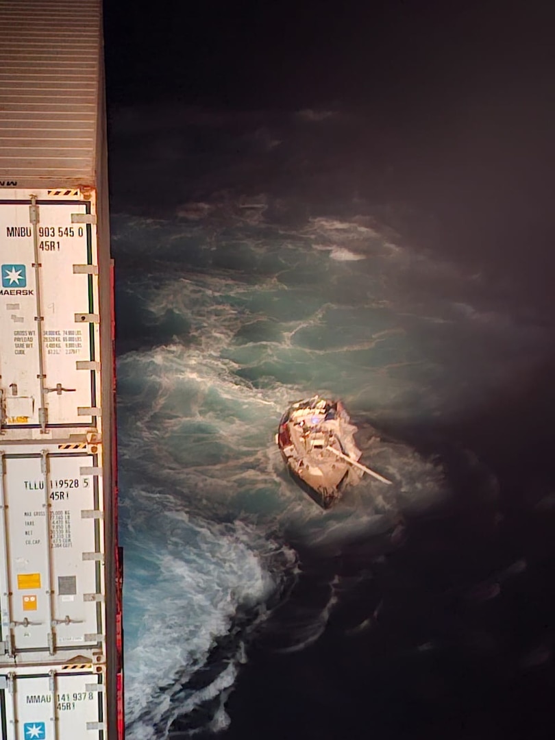 A Coast Guard Air Station Miami HC-144 Ocean Sentry aircrew works alongside the container ship Polar Mexico's crew to rescue a man aboard a disabled 34-foot sailing vessel, 35 miles off Cape Canaveral, Florida, Feb. 22, 2026.