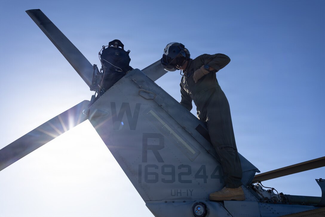 U.S. Marine Corps Maj. Sundar Pappu, a UH-1Y Venom utility helicopter pilot with Marine Light Attack Helicopter Squadron (HMLA) 775, Marine Aircraft Group 41, 4th Marine Aircraft Wing, performs a maintenance check at Marine Corps Air Station, Camp Pendleton, California, Jan. 29, 2026. During this period, Marines with HMLA-775 showcase tactical proficiency and lethality of the UH-1Y to the commanding general. (U.S. Marine Corps photo by Lance Cpl. Allan Rodriguez-Rivera)