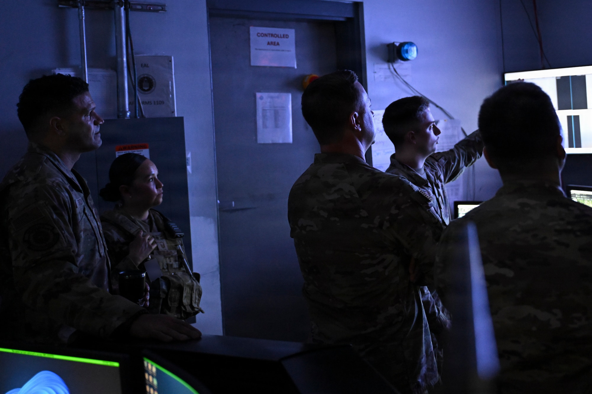 U.S. Air Force Senior Airman Walker C. Houchens, a 316th Security Forces Squadron Base Defense Operations Center controller explains BDOC operations to leadership during a visit in support of the February “Winnin’ Like a Griffin” recognition at Joint Base Andrews, Maryland, Feb. 17, 2026. The visit highlighted the critical role BDOC personnel play in installation security and command and control operations