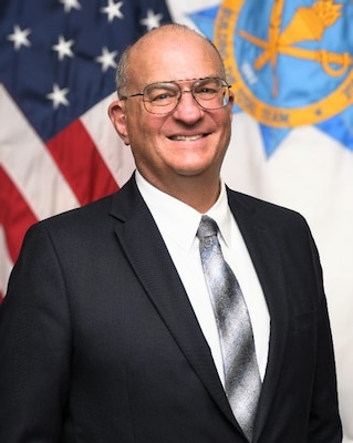 Army Management Staff College leader posing for a photo.