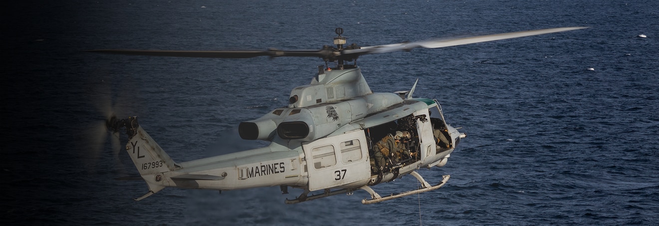 GULF OF MANNAR (Jan. 24, 2023) – U.S. Marine Corps UH-1Y Venom pilots with Marine Medium Tiltrotor Squadron (VMM) 362 (Rein.) and Marines with Maritime Raid Force, both with the 13th Marine Expeditionary Unit, conduct hoist operations aboard the amphibious transport dock USS Anchorage (LPD 23), Jan. 24. The 13th MEU is embarked on the Makin Island Amphibious Ready Group, comprised of amphibious assault ship USS Makin Island (LHD 8) and amphibious transport dock ships USS John P. Murtha (LPD 26) and the Anchorage, and operating in the U.S. 7th Fleet area of operations to enhance interoperability with Allies and partners and serve as a ready-response force to defend peace and maintain stability in the Indo-Pacific region. (U.S. Marine Corps photo by Sgt. Kevin G. Rivas)