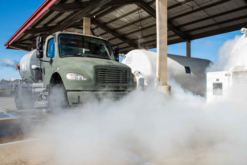 Smoke from a liquid nitrogen bleed-off is dispensed around truck.