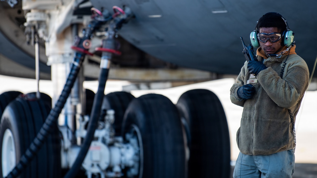 Airman uses radio on flight line