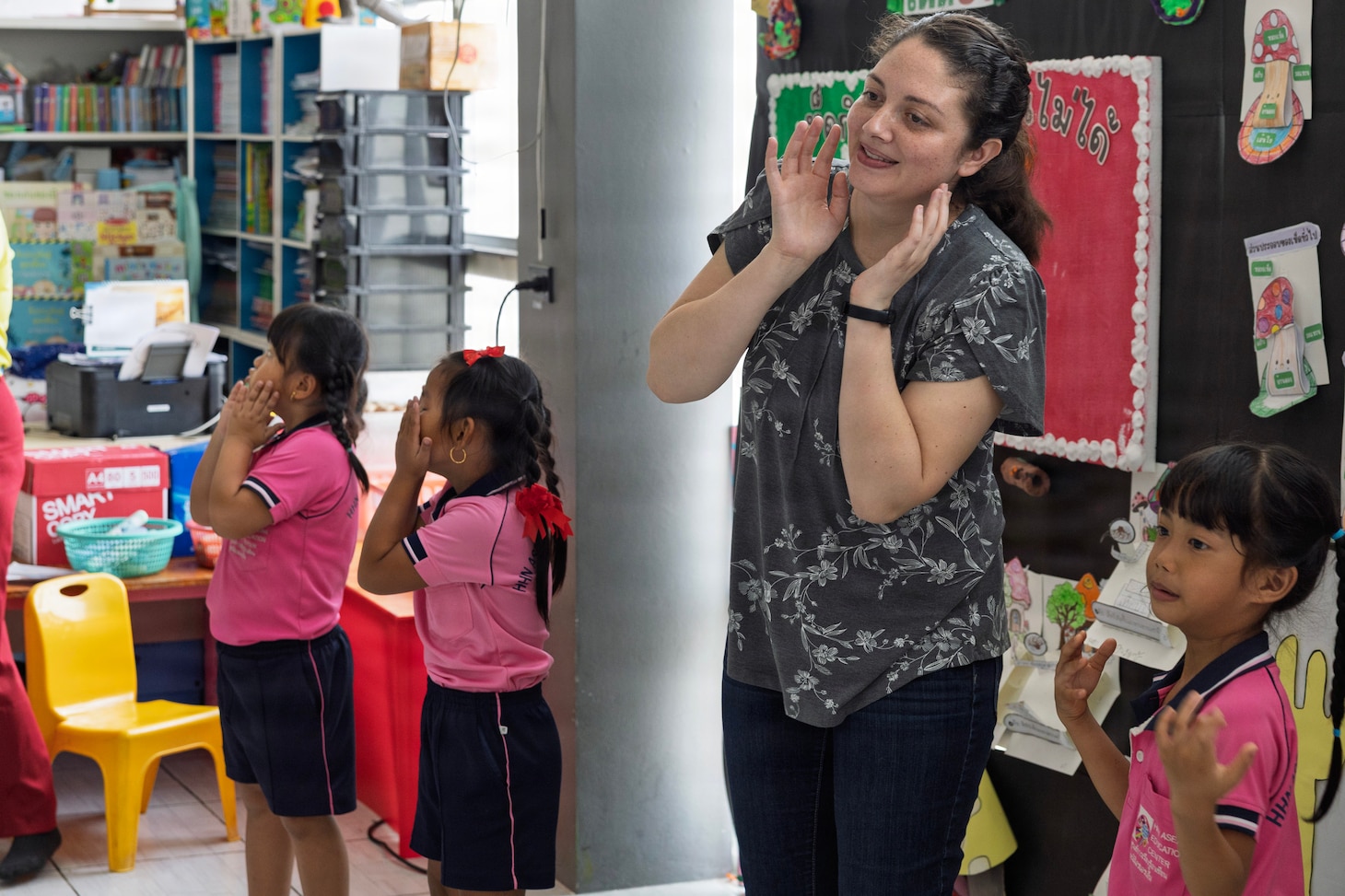 U.S. Navy Reserve Lt. Nicole Poolman, Military Sealift Command, Navy Reserve Expeditionary Port Unit Atlantic, plays with kids of the Learning Center, Human Help Network, during a community relations event at Pattaya, Thailand, Feb. 16, 2026.