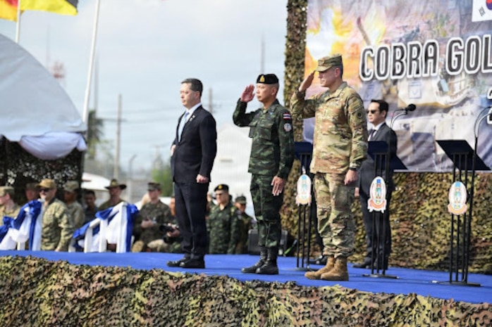 Sean K. O'Neill, U.S. Ambassador to Thailand, Gen. Ukris Boontanondha, Chief of Defense Forces Thailand, and U.S. Army Lt. Gen. Matthew W. McFarlane, the Commanding General of America’s First Corps and Joint Base Lewis-McChord, Wash., render a salute at the opening ceremony of Exercise Cobra Gold in Rayong Province, Thailand, Feb. 24, 2026.