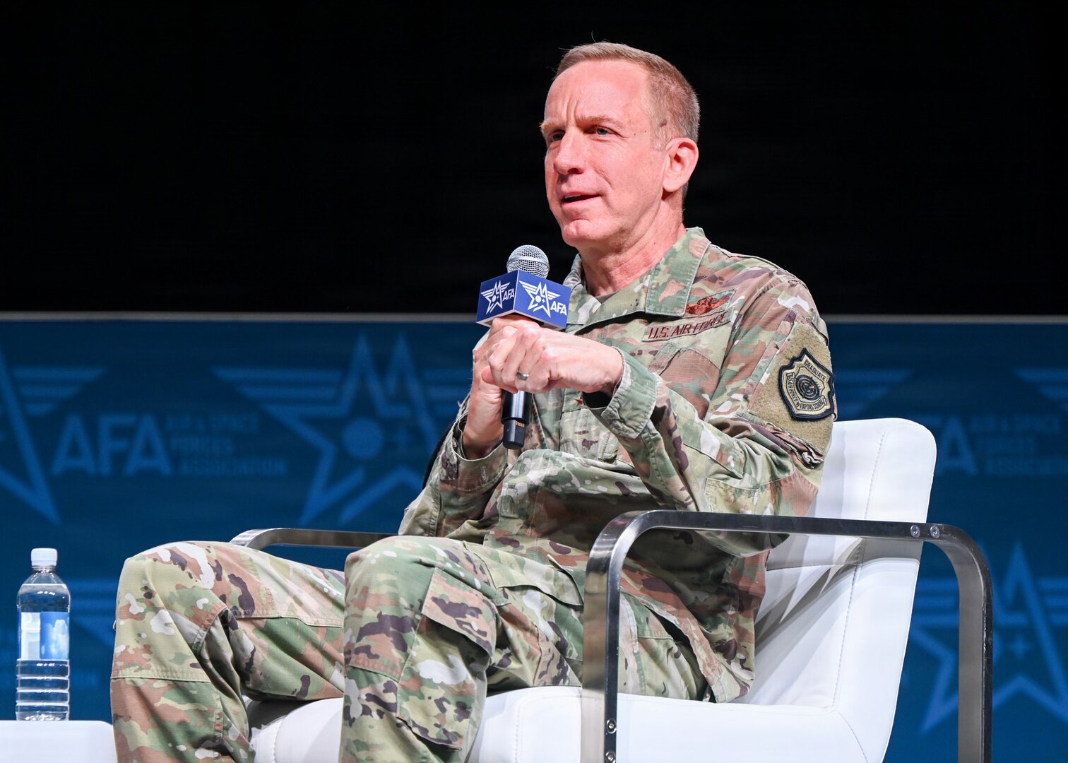 An Air Force leader speak at a panel.