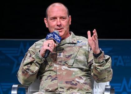 An Air Force leader speak at a panel.