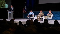 Air Force leaders speak at a panel.
