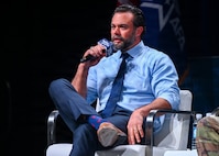 An Air Force leader speak at a panel.
