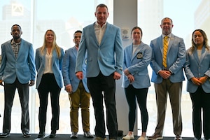 Master Sgt. Justin Schutz, Air Force Reserve recruiter, 350th Recruiting Squadron, stands center while fellow AFR recruiters from the 367th Recruiting Group, Robins Air Force Base, Georgia, celebrated new Operation Blue Suit members during the Recruiting Training Event Jan 26, 2026, in St. Louis, Missouri. The RTE held Jan 25-30, 2026, trains Air Force Reserve recruiters and celebrates recruiting accomplishments over FY25 after exceeding the AFR recruiting goal of 7,600 for a second consecutive year. (U.S. Air Force photo by Tech. Sgt. Della Creech)