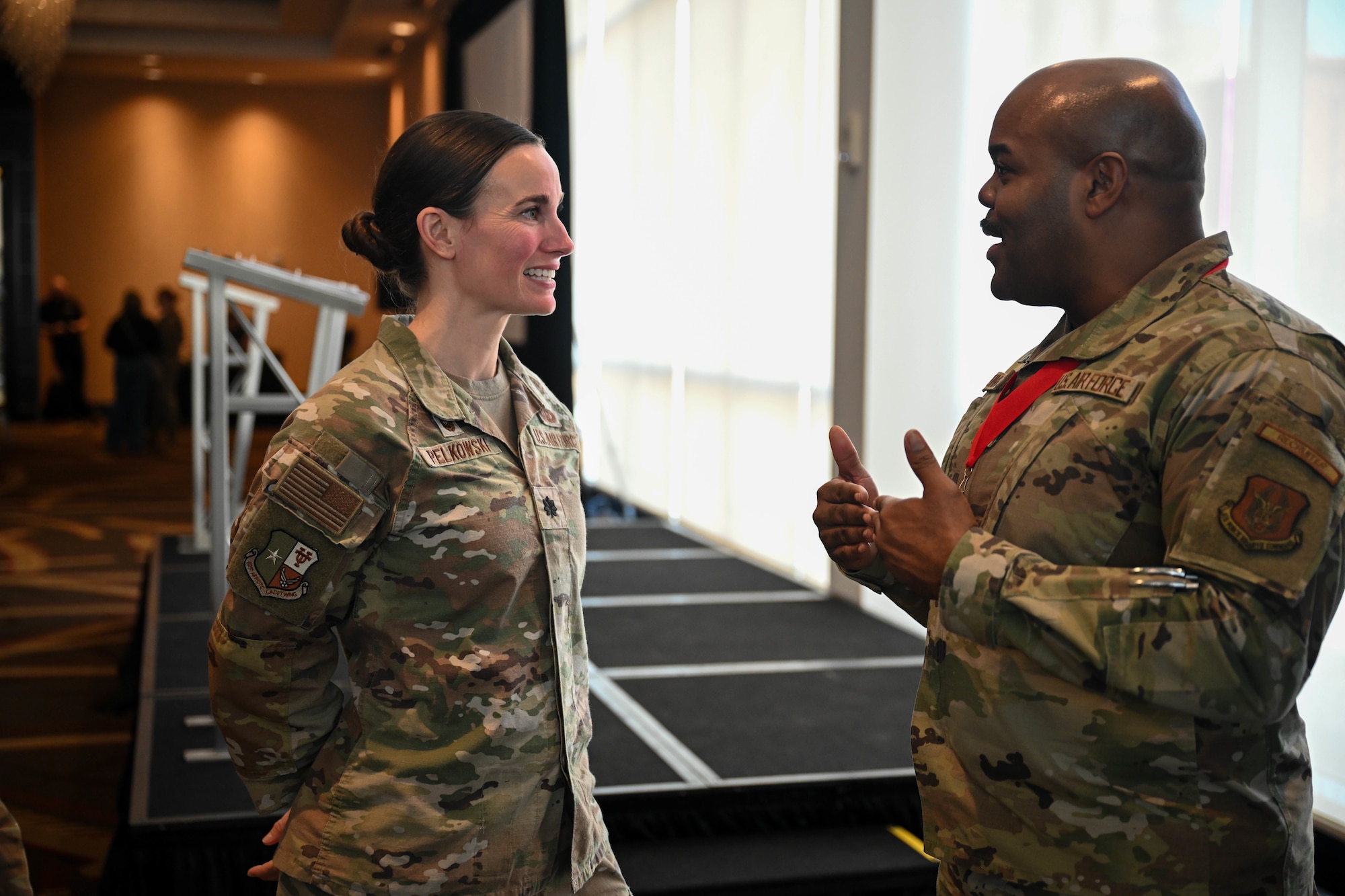 Staff Sgt. Jamaal Dunham, enlisted accessions recruiter, 351st Recruiting Squadron, Louisiana, discusses social media benefits and needs with Lt. Col. Amanda Pelkowski, social media keynote speaker and Detachment 825 ​​commander, Air Force Reserve Officer Training Corps (AFROTC), during social media training at the Recruiting Training Event Jan 28, 2026, in St. Louis, Missouri. The RTE held Jan 25-30, 2026, trains Air Force Reserve recruiters and celebrates recruiting accomplishments over FY25 after exceeding the AFR recruiting goal of 7,600 for a second consecutive year. (U.S. Air Force photo by Tech. Sgt. Della Creech)