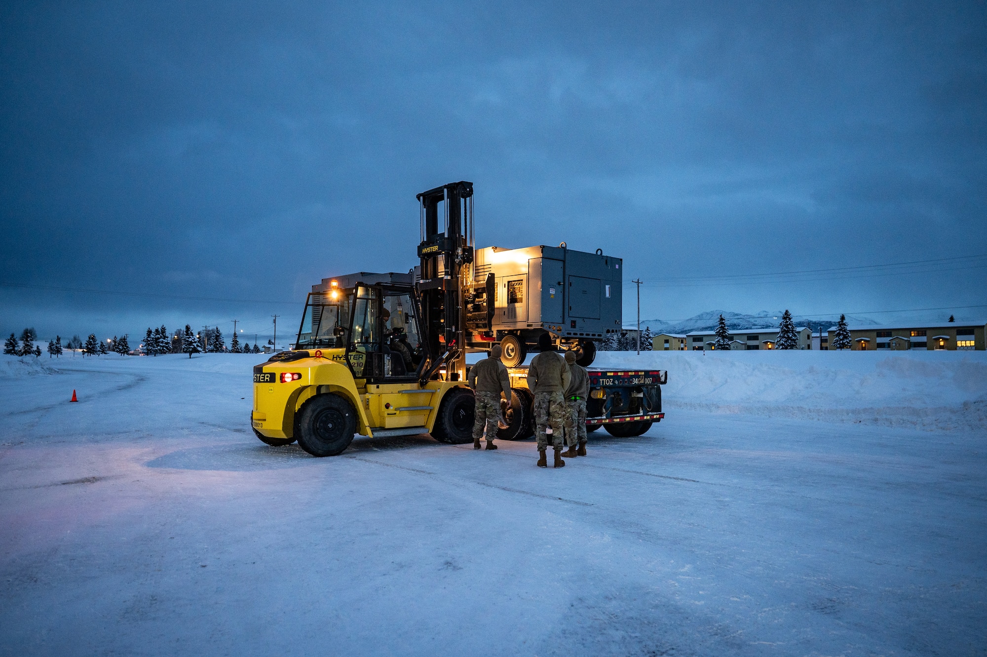 U.S. Air Force Airmen assigned to the 773d Logistics Readiness Squadron load Prepositioned Warfighting Materiel at Joint Base Elmendorf-Richardson, Alaska, Jan. 15, 2026. The materiel consists of rapidly deployable equipment sets that enable facility establishment, communications, and aircraft sortie generation in austere environments, thereby reducing the need for long-distance airlift of supplies. (U.S. Air Force photo by Senior Airman Hunter Hites)