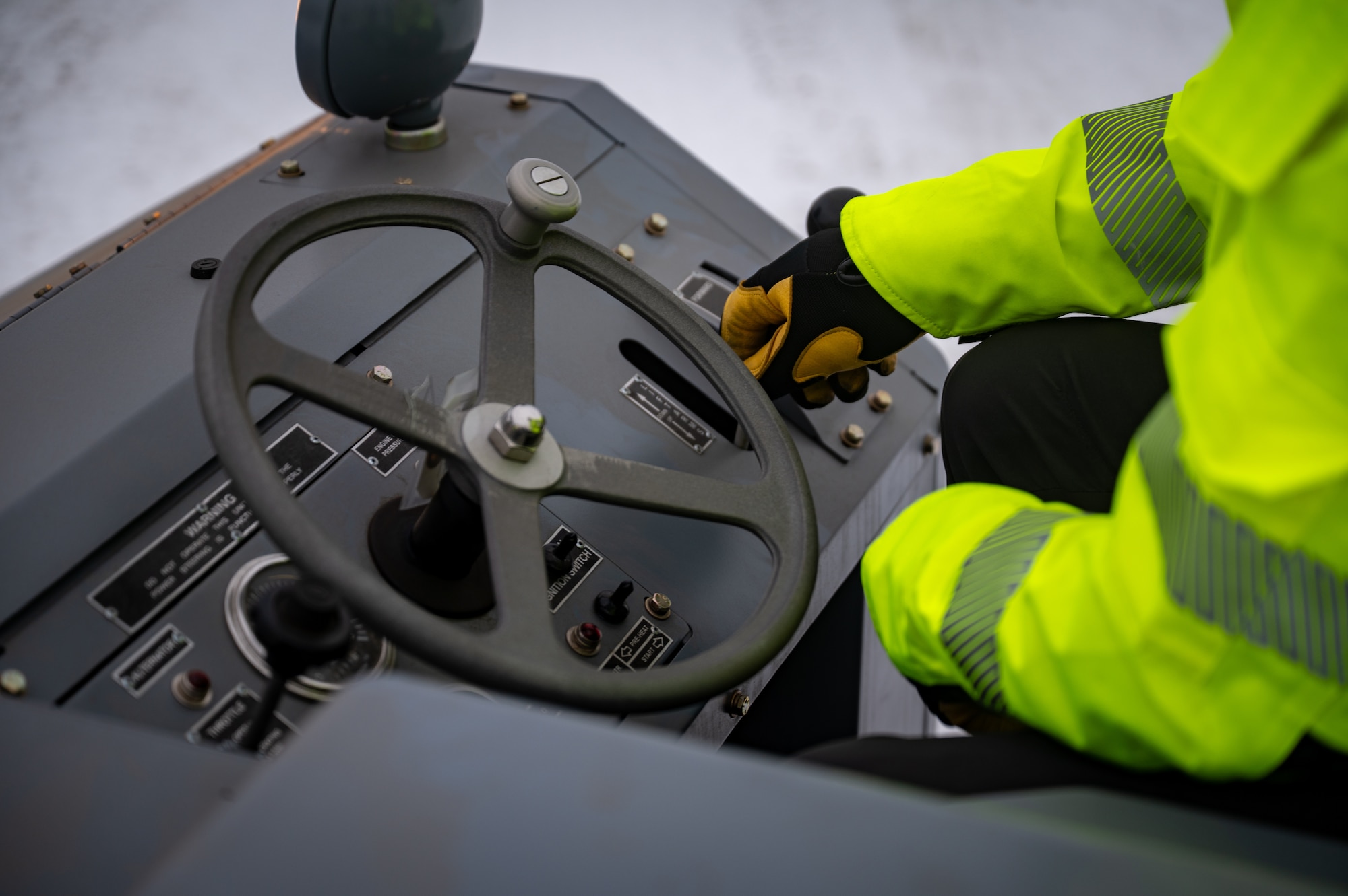 Matt Davis, 673d Logistics Readiness Squadron contractor, loads Prepositioned Warfighting Materiel onto a trailer at Joint Base Elmendorf-Richardson, Alaska, Jan. 15, 2026. The materiel consists of rapidly deployable equipment sets that enable facility establishment, communications, and aircraft sortie generation in austere environments, thereby reducing the need for long-distance airlift of supplies. (U.S. Air Force photo by Senior Airman Hunter Hites)