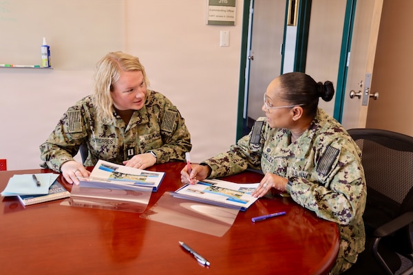 TWENTYNINE PALMS, Calif. (Feb. 19, 2026) — Lt. Gillian Gutierres, left, participates in a one-on-one meeting with commanding officer Capt. Janiese Cleckley during the Commanding Officer for a Day program at Navy Medicine Readiness and Training Command Twentynine Palms. The initiative provides junior officers firsthand exposure to command-level leadership and decision-making. (U.S. Navy photo by Christopher Jones, NMRTC Twentynine Palms public affairs officer)