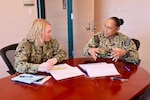TWENTYNINE PALMS, Calif. (Feb. 19, 2026) — Lt. Gillian Gutierres, left, participates in a one-on-one meeting with commanding officer Capt. Janiese Cleckley during the Commanding Officer for a Day program at Navy Medicine Readiness and Training Command Twentynine Palms. The initiative provides junior officers firsthand exposure to command-level leadership and decision-making. (U.S. Navy photo by Christopher Jones, NMRTC Twentynine Palms public affairs officer)