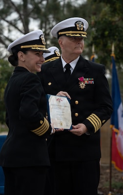 Navy Capt. Virginia Damin, commanding officer, Navy Medicine Readiness and Training Command Camp Pendleton and director, Naval Hospital Camp Pendleton, presents Capt. Kenneth Basford, outgoing commanding officer of Expeditionary Medical Facility 150 Alpha with the Legion of Merit Medal in recognition of his exceptionally meritorious conduct in the performance of outstanding service throughout his time in command during the EMF 150 Alpha change of command ceremony aboard NHCP on Feb. 20, 2026. Basford relinquished command to Smiley, his executive officer, during the time-honored ceremony. Basford is retiring from the Navy after 30 years of active service. “I am very humbled to have served as your commanding officer, and I know Captain Smiley will take the command to even greater accomplishments,” said Basford during his remarks.