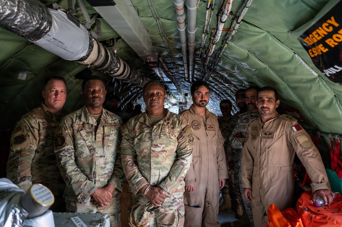 U.S. Airmen and Qatar Emiri Air Force members tour a KC-135 Stratotanker during Partnership Day at Al Udeid Air Base, Qatar, Feb. 11, 2026. The event united Qatari military members and families with U.S. service members and coalition forces. (U.S. Air Force photo by Staff Sgt. Alexis Orozco)