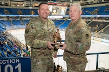 Sgt. 1st Class Jashual Vazquez (left) accepted the Tobyhanna Army Depot Outstanding Active-Duty Servicemember award from Maj. Joseph A. Page (right).