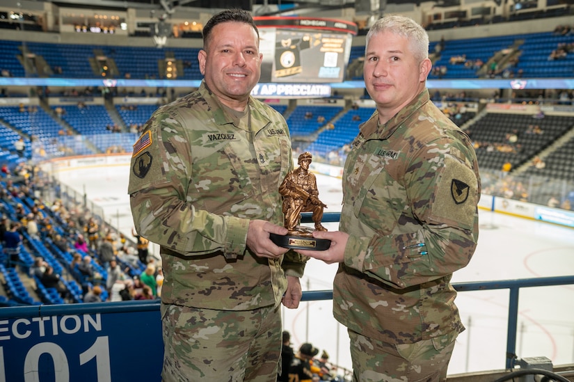 Sgt. 1st Class Jashual Vazquez (left) accepted the Tobyhanna Army Depot Outstanding Active-Duty Servicemember award from Maj. Joseph A. Page (right).