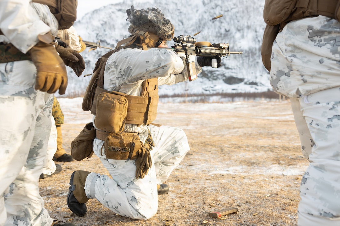 U.S. Marine Corps Lance Cpl. Riley Wissel, a logistics specialist with 2nd Distribution Support Battalion, Combat Logistics Regiment 27, 2nd Marine Logistics Group, fires an M16A4 service rifle in the kneeling position at a cold weather live-fire range in preparation for exercise Cold Response 26 in Elvegardsmoen, Norway, Feb. 19, 2026. Marines and Sailors increased weapon proficiency, confidence and lethality by implementing their knowledge of cold weather gear in conjunction with live-fire maneuvers in an austere environment. A key component of NATO's enhanced vigilance activity Arctic Sentry, exercise Cold Response 26 is a Norwegian-led winter military exercise designed to enhance collective defense capabilities and ensure U.S. readiness to rapidly deploy and seamlessly operate alongside NATO Allies in challenging arctic conditions. Wissel is a native of Maryland. (U.S. Marine Corps photo by Lance Cpl. Franco Lewis)